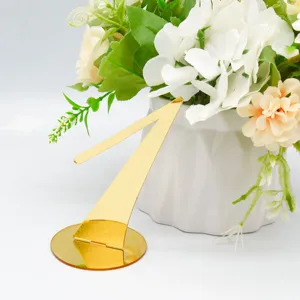 Gold acrylic table number 1 detail view, elegant wedding reception decor and event seating sign.