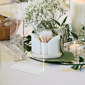 Clear acrylic wedding table number sign with arch design and elegant white base for party decor