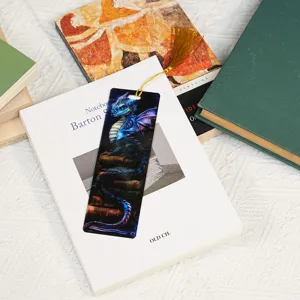 Detailed view of translucent acrylic dragon bookmark, 1mm thin design with a golden tassel.