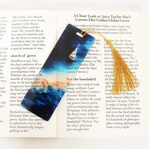Translucent acrylic bookmark with gold tassel, abstract seascape design for reading books.