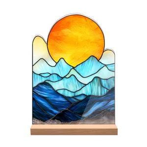 Stained glass style landscape acrylic ornament detail view showcasing vibrant sun and mountain motif.