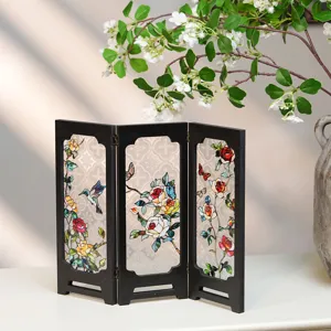 Detailed close-up of the vintage miniature three-panel screen decor with stained glass flower.
