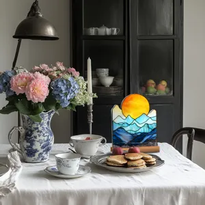 Detailed view of the acrylic sunset mountain desktop ornament featuring a stylish wooden base.