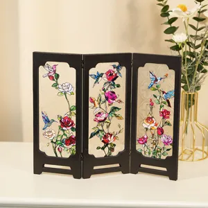 Miniature vintage stained glass folding screen table decoration showing hummingbird and rose floral art detail.