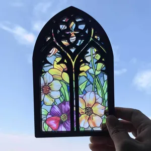 Gothic window translucent stained glass floral hanging ornament detail backlit by sky