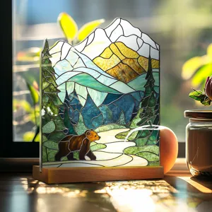 Detailed acrylic desktop ornament detail showcasing stained glass mountain and bear art.