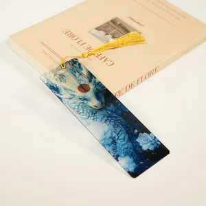 Translucent acrylic bookmark with blue dragon pattern and golden tassel for students.