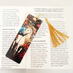 Translucent acrylic bookmark with unicorn design and gold tassel, perfect reading accessory.