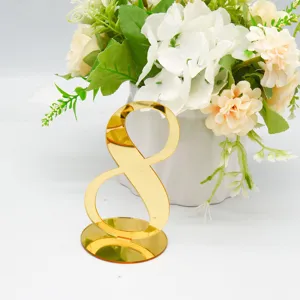 Gold acrylic table number 8 detail shot wedding party table decor sign with base.