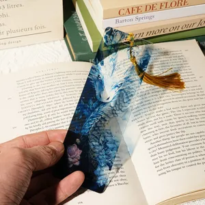 Transparent acrylic dragon bookmark with gold tassel, detailed fantasy art and clear reading accessory.