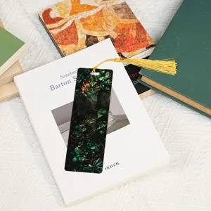 Close-up view of a stunning translucent acrylic bookmark featuring an intricate dragon design.