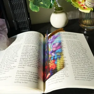 Translucent colorful acrylic bookmark detail shot showing light refraction and tassel design.