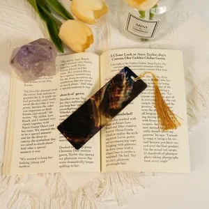 Translucent acrylic dragon bookmark with tassel, aesthetic student stationery art gift.
