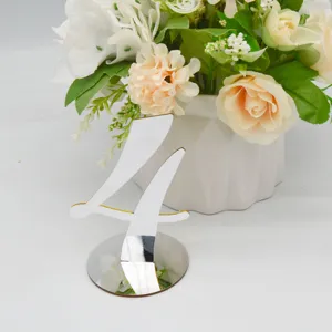 Acrylic table number 4 for wedding and restaurant seating decoration detail shot.