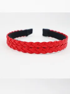 Red braided faux leather headband close up detail showcasing the woven texture and design.