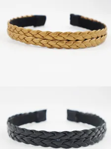 Gold and black braided hair hoop detail showing premium texture and dual layer design style.