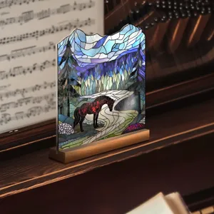 Close-up of stained glass style acrylic horse ornament with wooden base, forest scenic detail.
