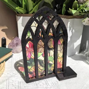 Detailed view of wooden Gothic arched window bookend with vibrant floral stained glass art.