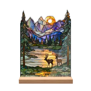 Close-up detail of the stained glass style acrylic mountain and deer landscape desktop ornament.