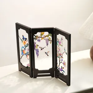 Detailed view of vintage desktop folding screen with translucent stained glass floral patterns.