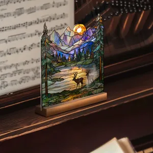 Detailed view of the stained glass style acrylic landscape desktop ornament with wooden base.
