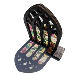 Close-up of gothic wooden arched window ornament with colorful stained glass light effect.