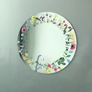 Espejo acrílico redondo decorativo con diseño de corona floral de acuarela colorida.