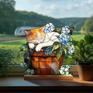Close-up of stained glass style sleeping cat acrylic ornament with wooden base for home decor.