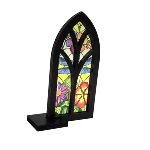 Detailed close-up shot of the stained wooden arched window decor, elegant tabletop ornament.