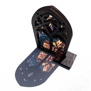 Gothic wooden stained glass window ornament detail showing colorful light projection shadow.
