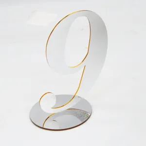 Acrylic table number sign with mirror base, perfect for wedding and restaurant seating decor.