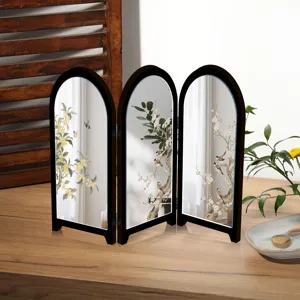 Close-up detail of the mini desktop folding mirror screen with exquisite floral and bird art.