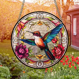 Stained glass hummingbird hanging suncatcher detail view in garden, acrylic window decor