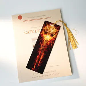 Detailed view of 1mm acrylic translucent bookmark featuring dragon and crown design with tassel.