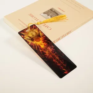 Exquisite acrylic bookmark with golden tassel, featuring stained glass crown design for reading.