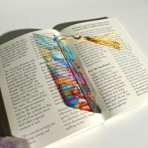Creative translucent acrylic bookmark with colorful stained glass pattern and elegant gold tassel.