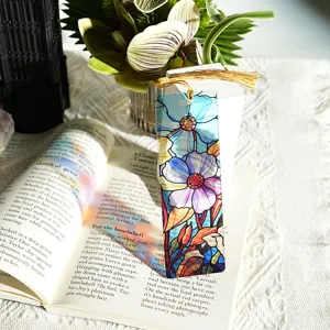Transparent stained glass acrylic bookmark with gold tassel, colorful light refracting design.