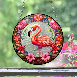 Detailed shot of circular acrylic stained glass flamingo suncatcher hanging decor with vibrant floral ring.
