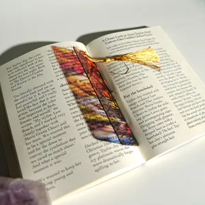 Creative colored translucent acrylic bookmark with golden tassel, gorgeous light refraction style.