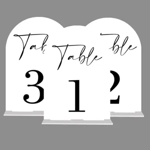 Acrylic wedding table numbers set, arched place cards detail view, modern party decor display.