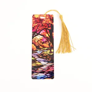 Close-up detail of the acrylic translucent bookmark featuring vibrant autumn landscape and gold tassel.