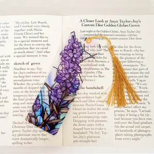 Acrylic bookmark with purple floral stained glass design and elegant golden tassel for reading.