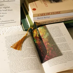 Exquisite acrylic translucent bookmark featuring a vibrant dragon pattern and elegant golden tassel.