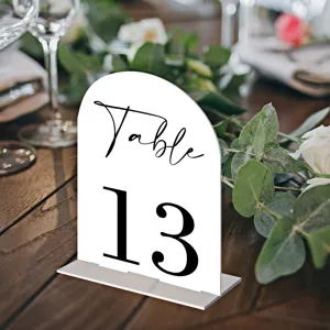 Acrylic wedding table number sign, arched white table sign with black lettering for event decor.