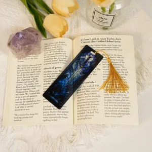 Translucent acrylic bookmark with gold tassel, dragon pattern design, student stationery craft.