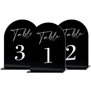 Black acrylic arch table numbers for wedding reception, modern table signs with white text.