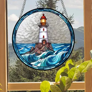 Detail view of the round acrylic stained glass lighthouse suncatcher hanging in window.