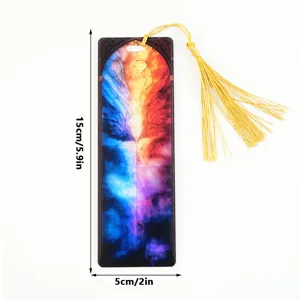 Acrylic bookmark with colorful wing design and golden tassel, translucent reading page marker.