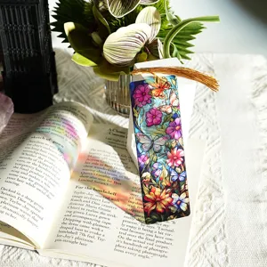 Colorful translucent acrylic bookmark with gold tassel, floral butterfly design detail photo.