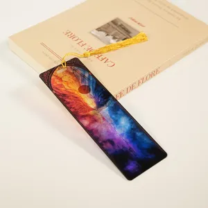 Acrylic translucent bookmark with golden tassel, colorful galaxy and wing design for reading books.